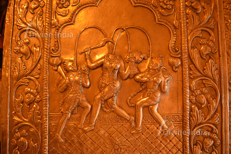 Devi Chandi Devi Jaya and Devi Vijaya emboss picture at Chinpturni temple entrance gate