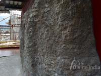 inside rock and backside of dhari devi idol