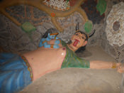 Putna Vadh Sculpture at Moksha Dham Temple